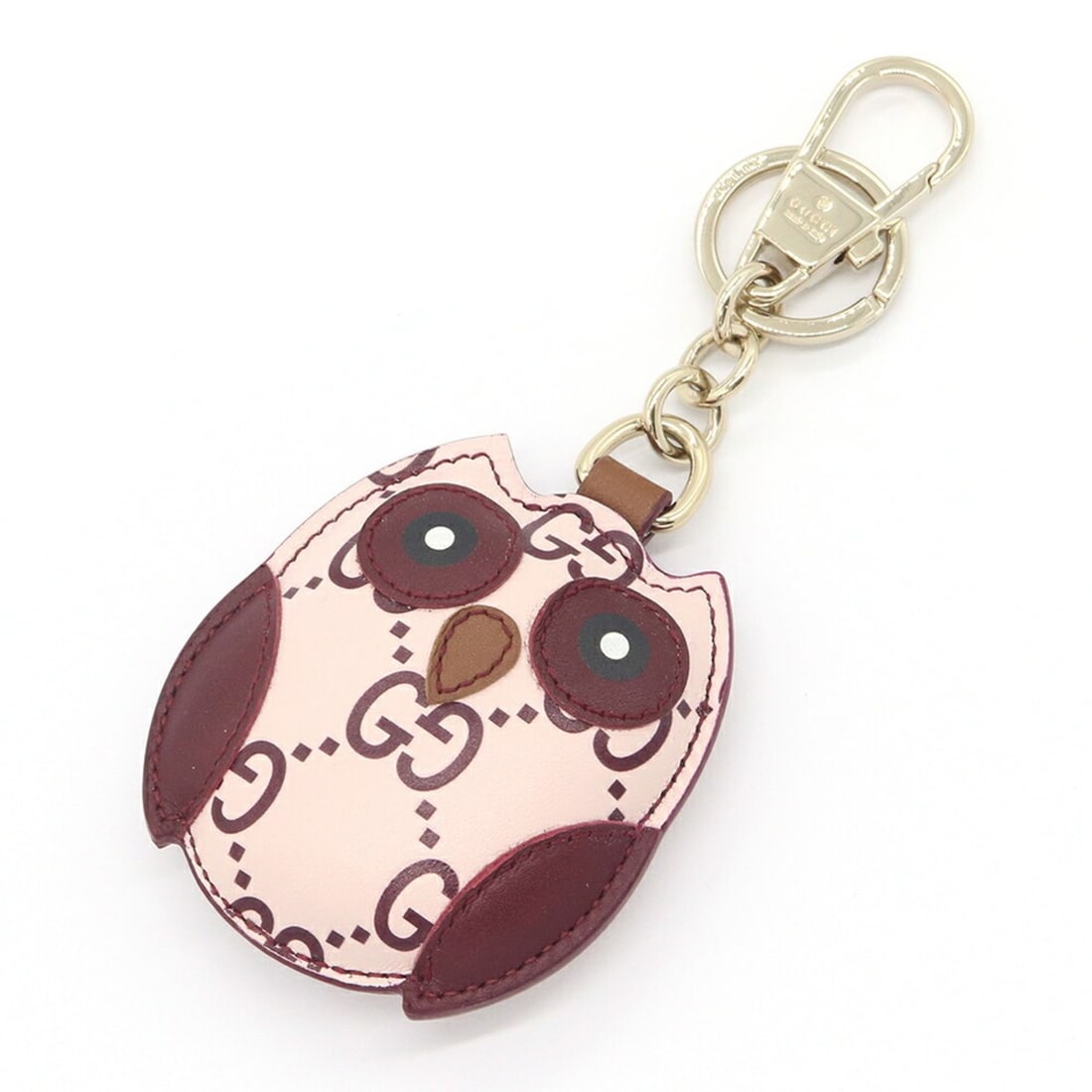Gucci accessory bag charm, owl shape, 821813, light pink/burgundy leather keychain/key ring, design,: --- Catalog ---Category: SizeSize (HxWxD): 8cm x 6.5cm / 3.14'' x 2.55''Category: DesignType: KeyringColor: Bordeaux, Light pinkGender: WomenMaterial: LeatherCategory: GeneralBrand: GucciCountry of Or
