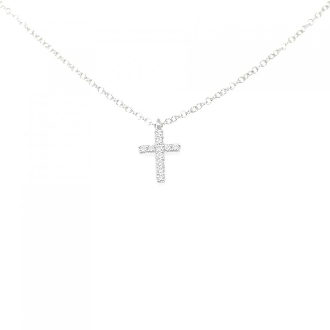 Tiffany Metro Cross Mini Necklace: --- Catalog ---Category: SizePendant Size: 9.7mm x 5.9mm / 0.38'' x 0.23''Neck Circumference: 41 cm / 16.14''Category: DesignColor: White goldStone: DiamondGender: WomenMaterial: White gold