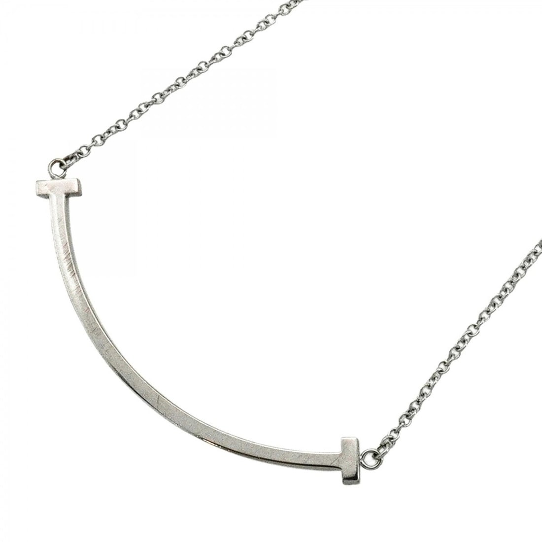 Tiffany & Co. T Smile Small Necklace, 18K White Gold, Women's: --- Catalog ---Category: SizePendant Size: 9.8mm x 37.8mm / 0.38'' x 1.48''Neck Circumference: 40.5 cm - 45.5 cm / 15.94'' - 17.91''Category: DesignGender: WomenMaterial: White gold (18K)Necklace Type