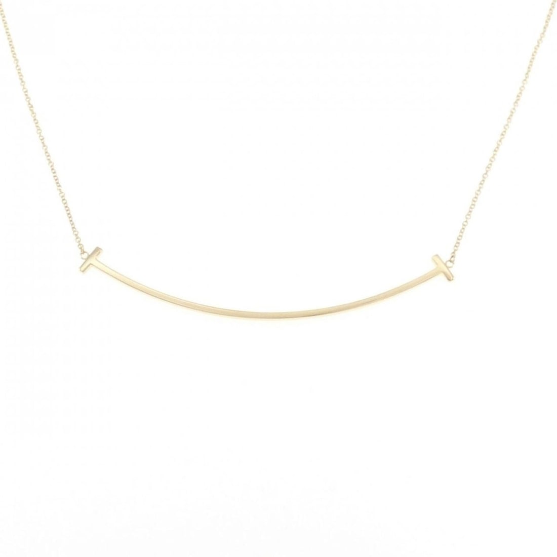 Tiffany & Co. T Smile Large Necklace: --- Catalog ---Category: SizePendant Size: 5.9mm x 68.6mm / 0.23'' x 2.7''Neck Circumference: 45 cm / 17.71''Category: DesignGender: WomenMaterial: Yellow gold (18K)Pendant Type: PendantNecklace