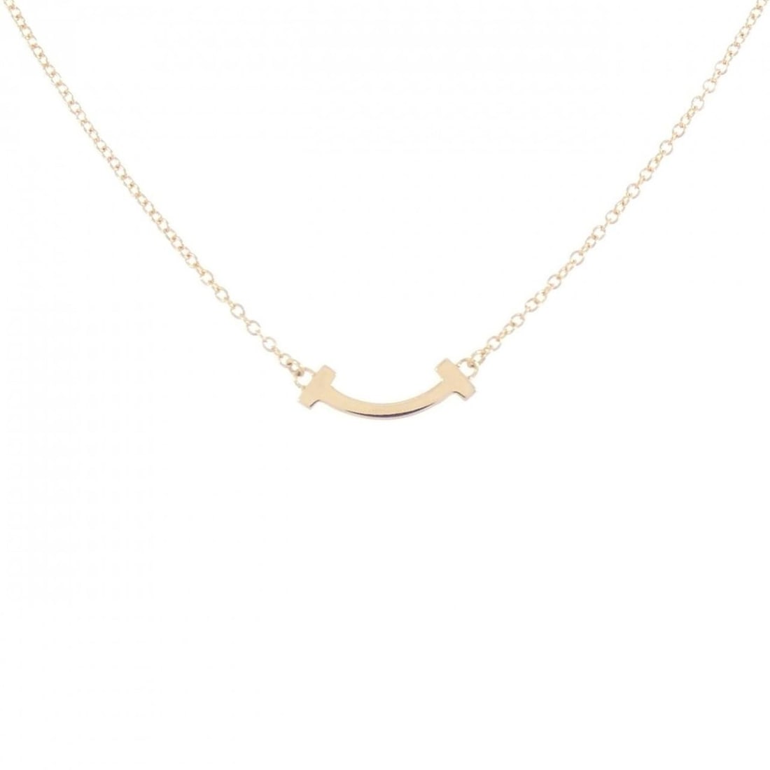 Tiffany T Smile Mini Necklace: --- Catalog ---Category: SizePendant Size: 3.6mm x 13.3mm / 0.14'' x 0.52''Neck Circumference: 41 cm - 46 cm / 16.14'' - 18.11''Category: DesignColor: Yellow goldGender: WomenMaterial: Yellow gold