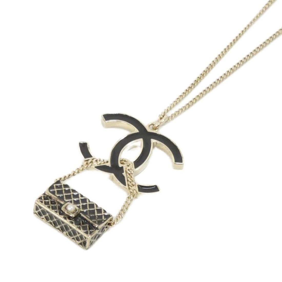 Chanel necklace: --- Catalog ---Category: SizePendant Size: 47mm x 30mm / 1.85'' x 1.18''Neck Circumference: 42 cm - 60 cm / 16.53'' - 23.62''Category: DesignColor: Black, WhiteGender: WomenNecklace Type: