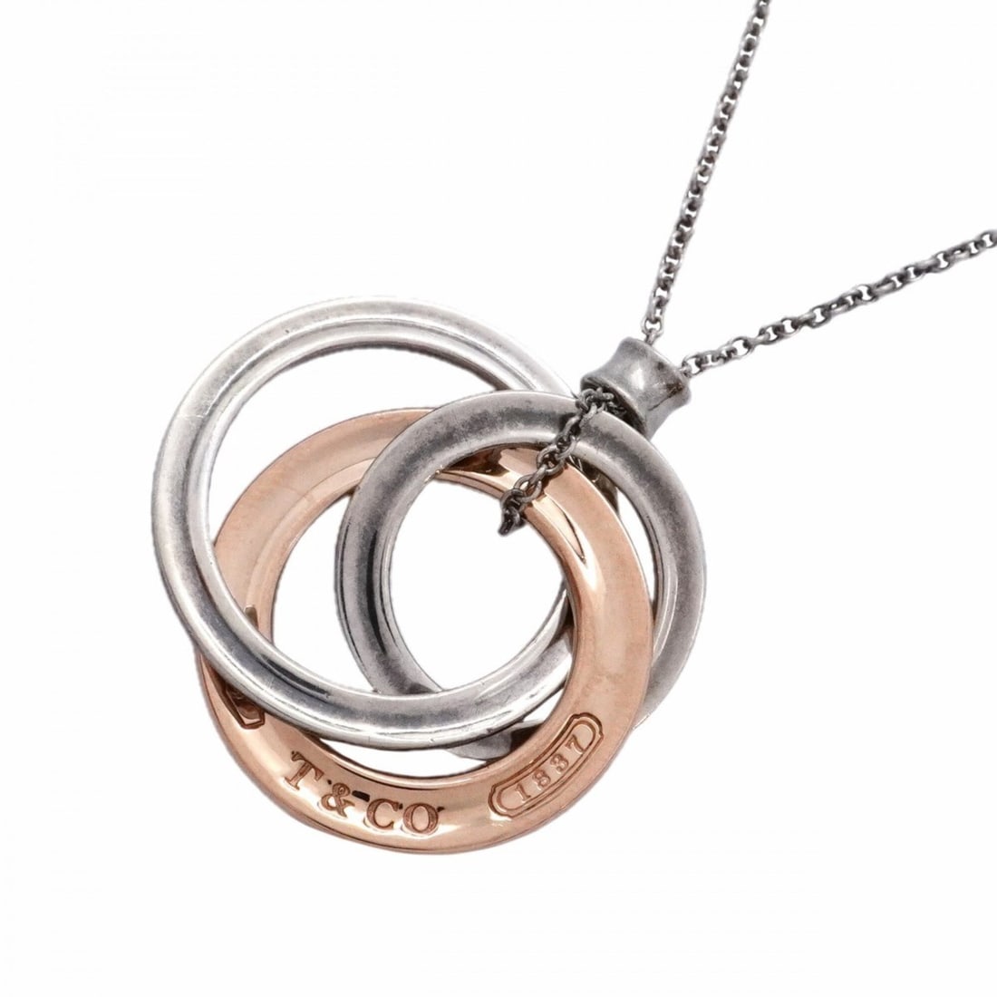 Tiffany & Co. Necklace 1837 Interlocking Sterling Silver 925 Rubedo Metal Women's: --- Catalog ---Category: SizePendant Size: 24.2mm x 23mm / 0.95'' x 0.9''Neck Circumference: 43.5 cm / 17.12''Category: DesignGender: WomenMaterial: Silver 925Necklace Type: NecklaceCategory: GeneralB