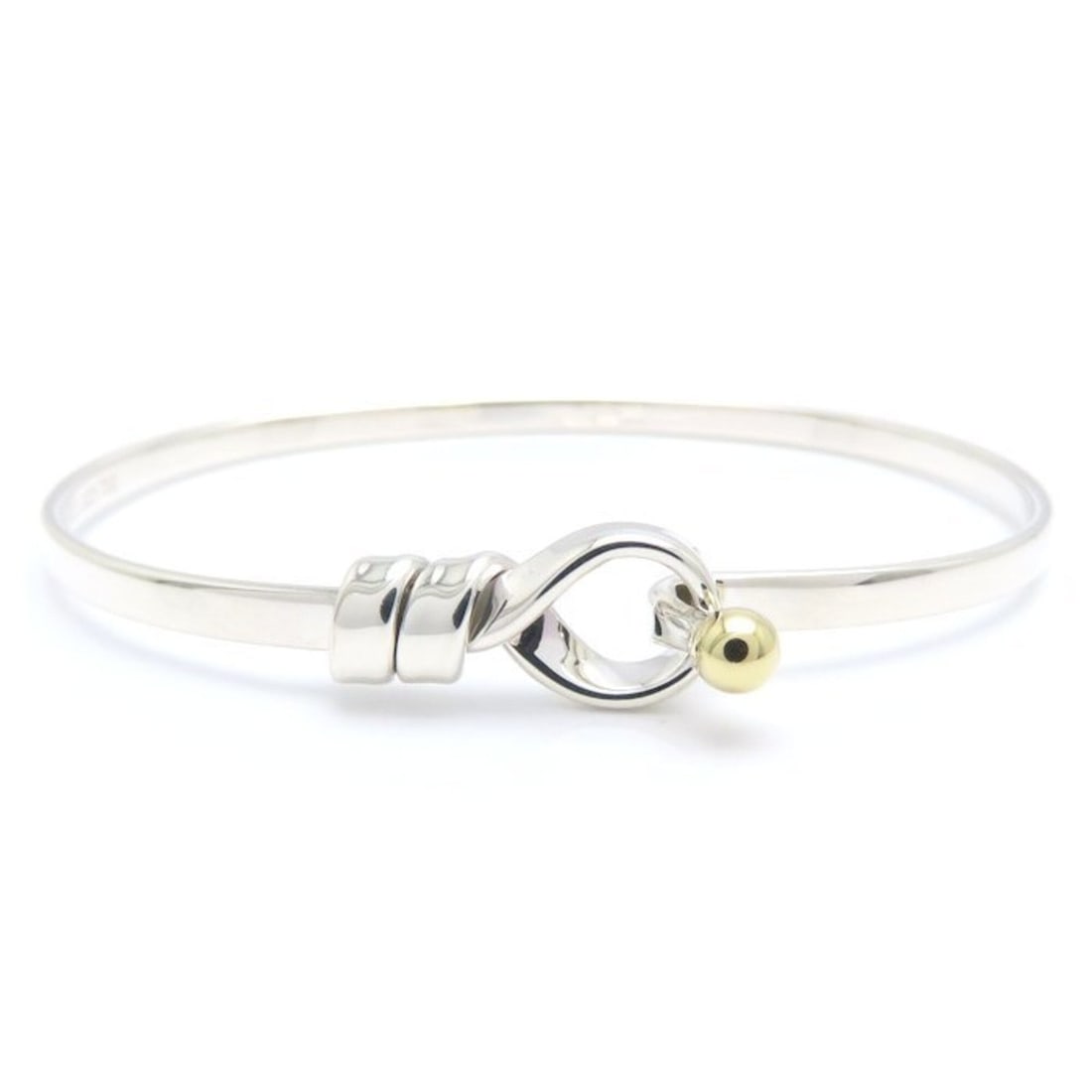 TIFFANY&Co. Tiffany Hook & Eye Bangle SV925 x 18K Yellow Gold Women's 295620: --- Catalog ---Category: SizeWidth: 3.1mm - 8.9mm / 0.12'' - 0.35''Length: 17cm / 6.69''Weight: 9.2g / 0.32oz.Category: DesignType: BangleGender: WomenClosure: HookMaterial: Silver 925, Yellow gold (1