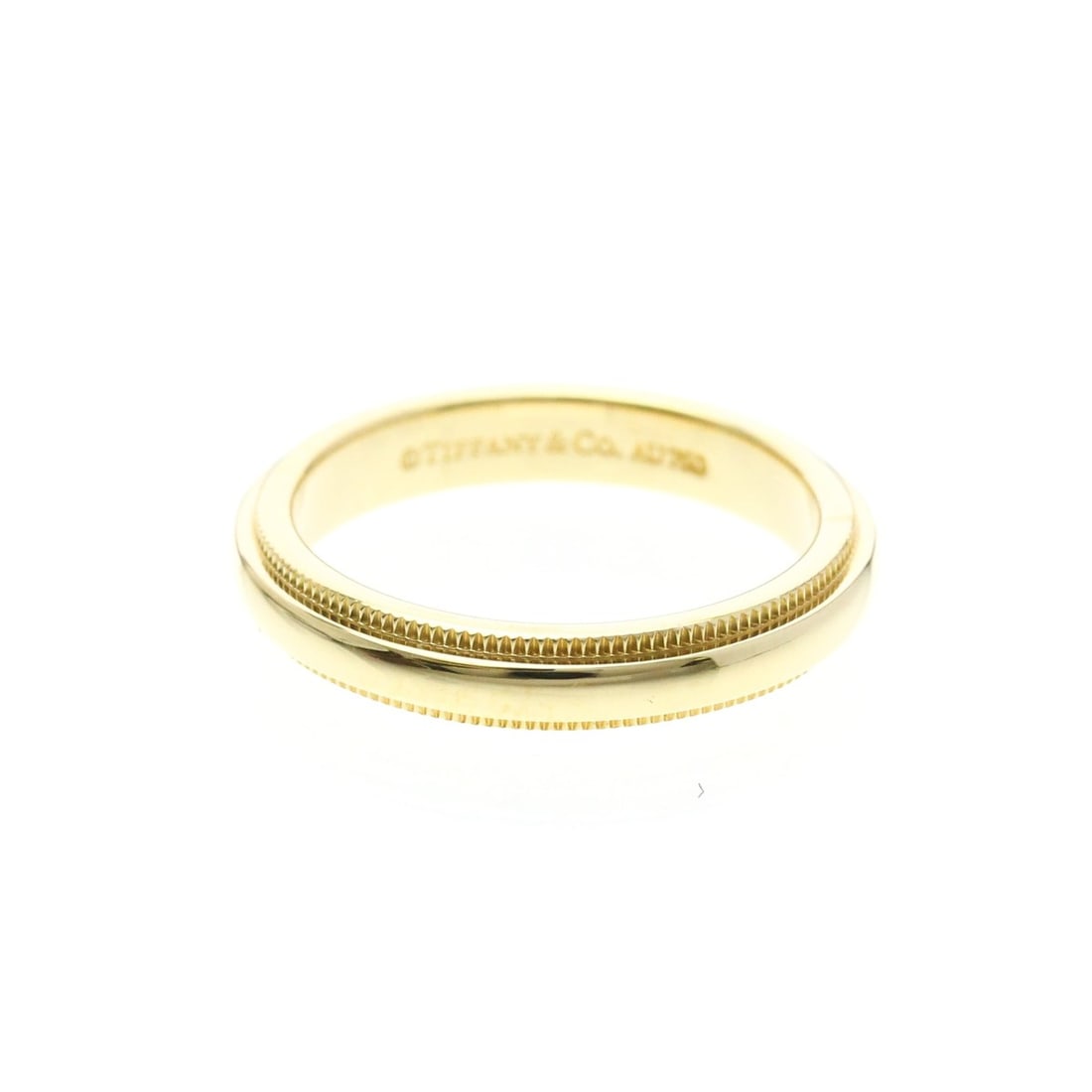 Tiffany Milgrain Ring Yellow Gold (18K) Fashion No Stone Band Ring Gold: --- Catalog ---Category: SizeWidth: 3.2mm / 0.13''Weight: 3.8g / 0.13oz.JP Size: 7.5US Size: 4-4.5Category: DesignType: Band ringColor: GoldMetal: GoldStone: No StoneStyle: FashionGender: Men,WomenMat
