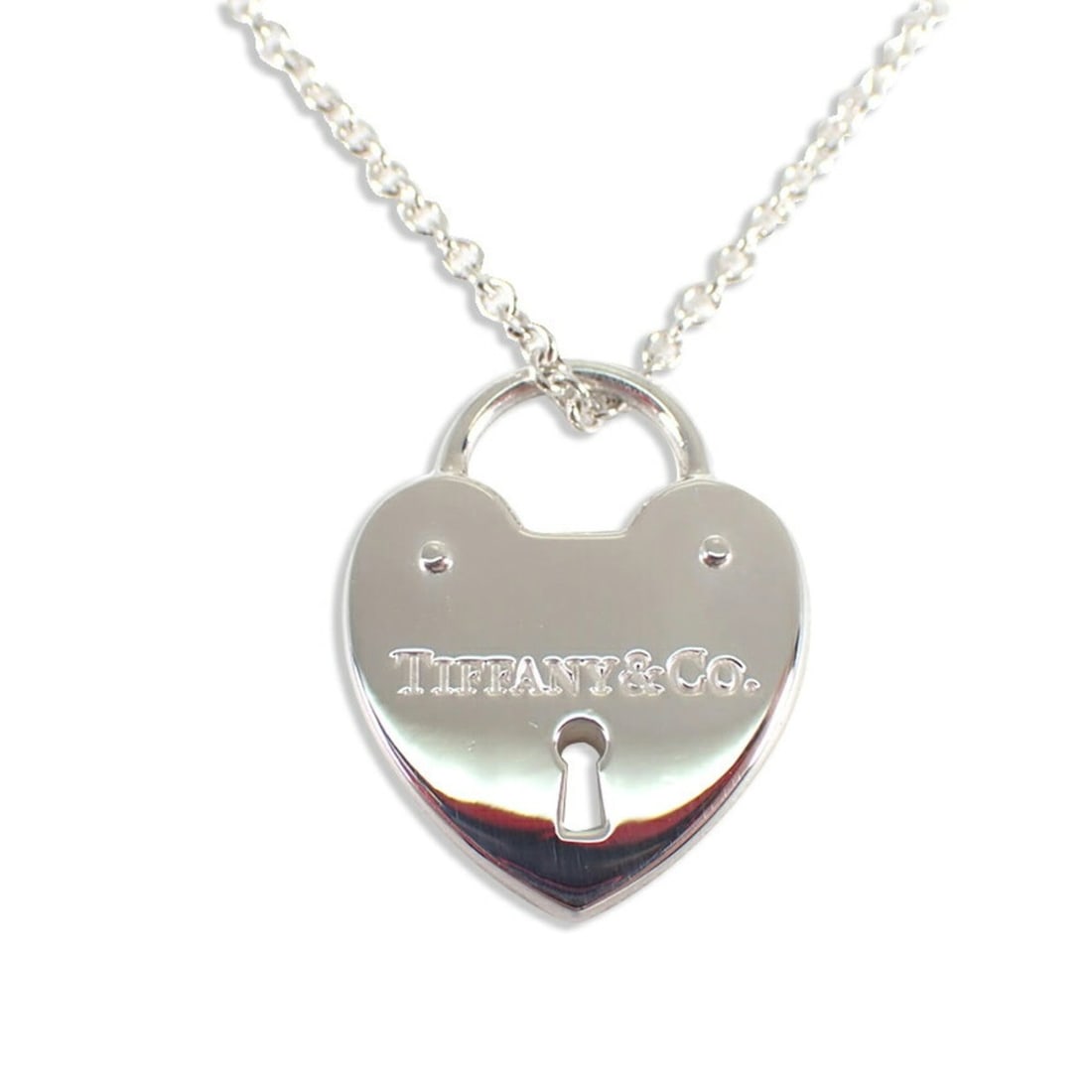 TIFFANY & Co. 925 Heart Lock Pendant Necklace: --- Catalog ---Category: SizePendant Size: 21mm x 16.5mm / 0.82'' x 0.64''Neck Circumference: 41 cm / 16.14''Category: DesignGender: WomenMaterial: Sterling silver 925Pendant Type: PendantNecklace Typ