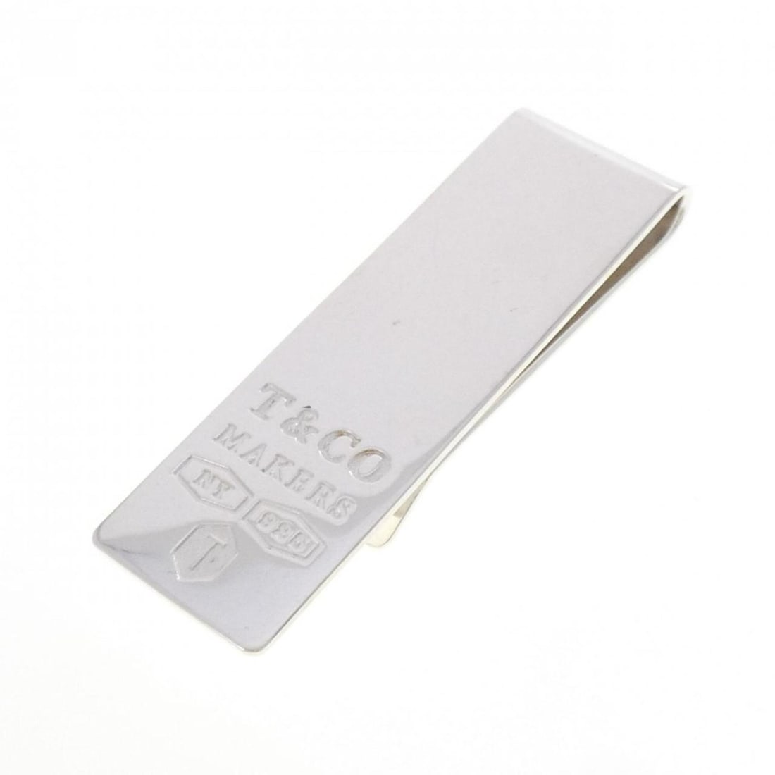 Tiffany Makers Narrow Money Clip: --- Catalog ---Category: SizeSize (HxWxD): 6cm x 1.8cm / 2.36'' x 0.7''Category: DesignType: Money clipGender: WomenMaterial: Silver 925 Category: GeneralMPN: 63660574Brand: Tiffany--- Item List