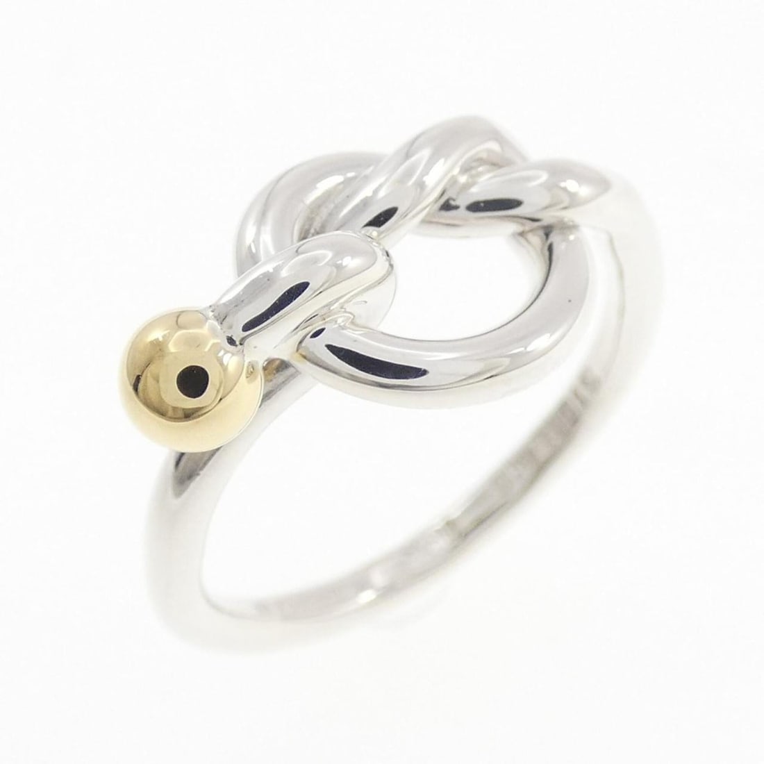 Tiffany Love Knot Ring: --- Catalog ---Category: SizeJP Size: 11.0US Size: 6Category: DesignType: Band ringGender: WomenMaterial: Silver, Yellow gold (18K)Category: GeneralBrand: Tiffany--- Item List ---Section: