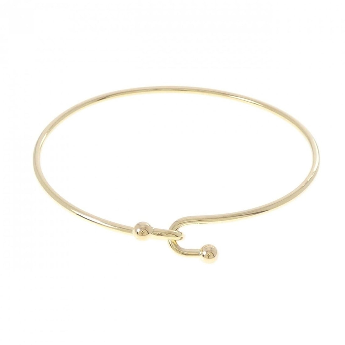 Tiffany & Co. 750YG Bangle: --- Catalog ---Category: SizeLength: 17.5cm / 6.88''Category: DesignType: BangleGender: WomenMaterial: Yellow gold (18K)Category: GeneralBrand: Tiffany--- Item List ---Section: ConditionRanking: Rank