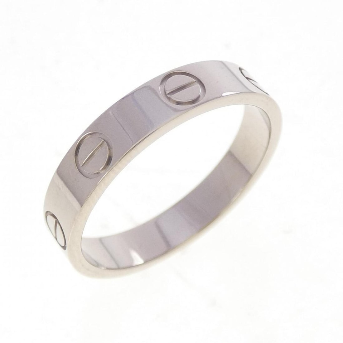 Cartier Mini Love Ring: --- Catalog ---Category: SizeUS Size: 6Brand Size: 51Category: DesignType: Band ringGender: WomenMaterial: White gold (18K)Category: GeneralMPN: B4085100Brand: Cartier--- Item List ---Section: