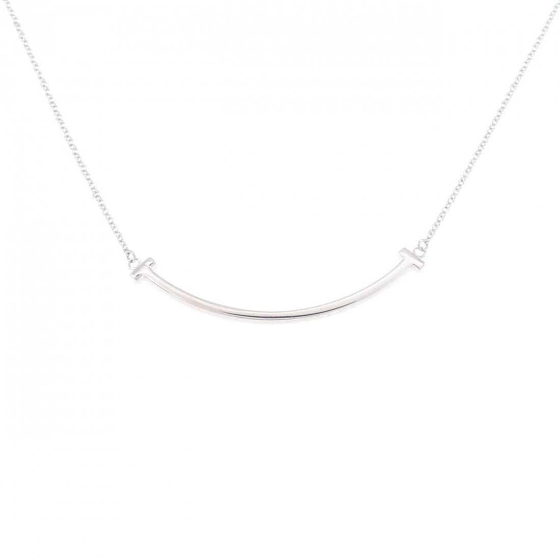 Tiffany T Smile Small Necklace: --- Catalog ---Category: SizePendant Size: 3.7mm x 37.1mm / 0.14'' x 1.46''Neck Circumference: 40 cm - 45 cm / 15.74'' - 17.71''Category: DesignGender: WomenMaterial: White gold (18K)Pendant Type: Pen
