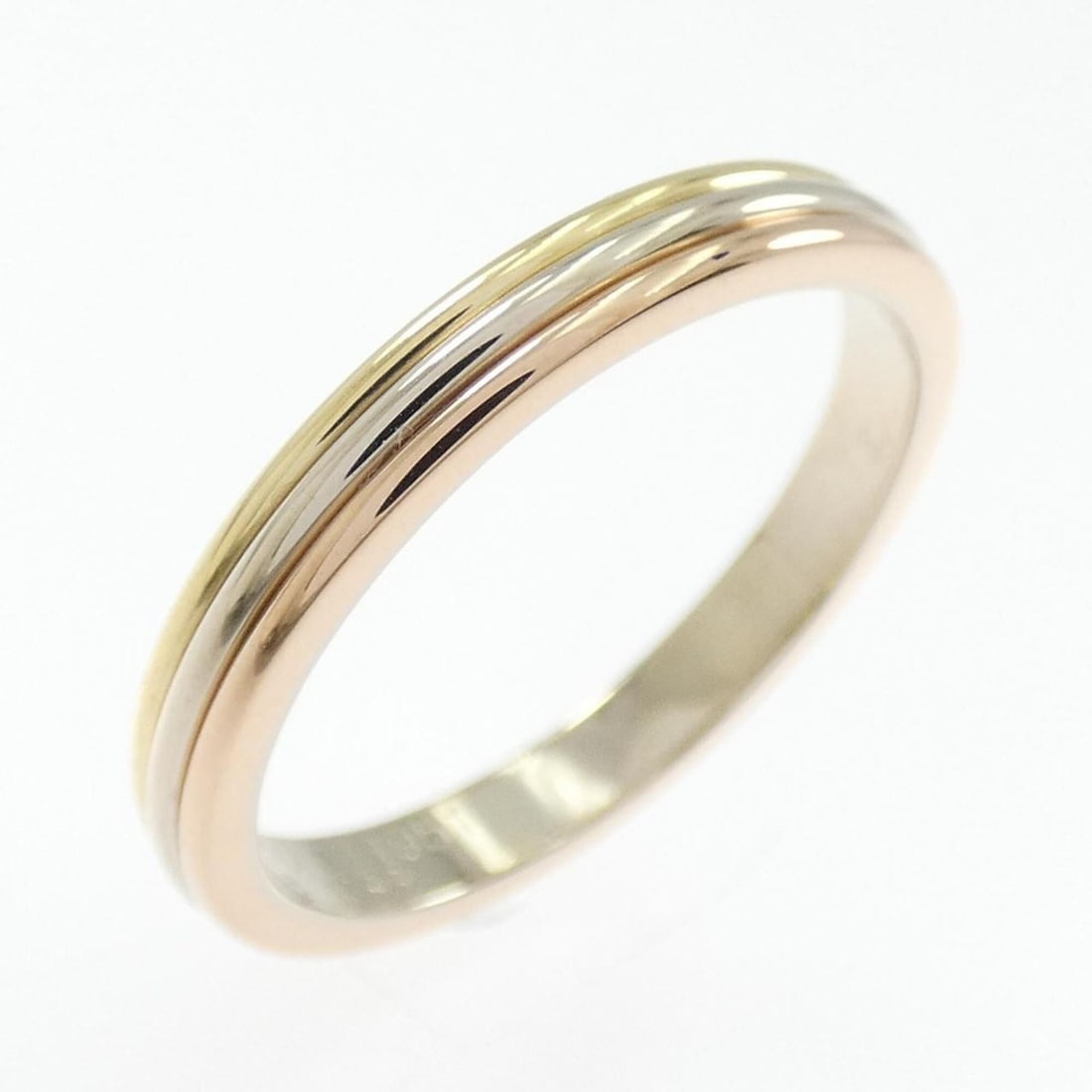 Cartier Three Gold Wedding Ring: --- Catalog ---Category: SizeUS Size: 9Brand Size: 58Category: DesignType: Band ringGender: WomenMaterial: Pink gold (18K), White gold (18K), Yellow gold (18K)Category: GeneralBrand: Cartier--- Item
