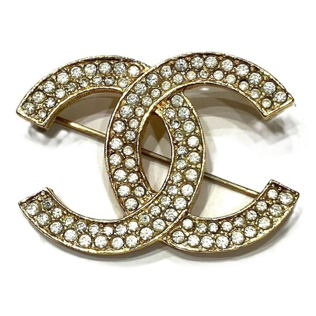 Chanel Rhinestone Coco Mark Brooch 174 - Women's Brand Accessory: --- Catalog ---Category: SizeSize (HxWxD): 3cm x 4.5cm / 1.18'' x 1.77''Category: DesignType: BroochColor: GoldStone: RhinestoneGender: WomenMaterial: Gold platingCategory: GeneralBrand: Chanel---