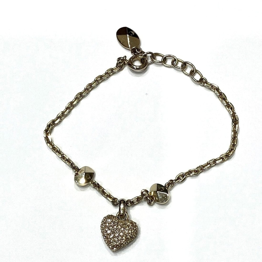 Christian Dior bracelet, accessory. Total weight 7.0g, 18cm, alloy with rhinestones.: --- Catalog ---Category: SizeLength: 18cm / 7.08''Category: DesignType: Charm braceletColor: GoldStone: RhinestoneMaterial: AlloyCategory: GeneralBrand: Christian Dior--- Item List ---Section: Conditi