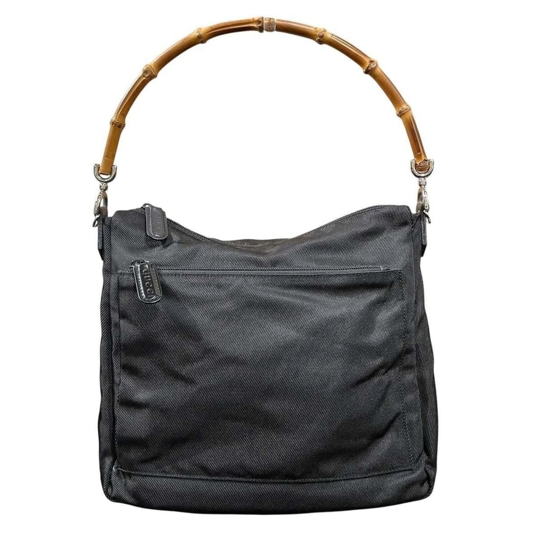 Gucci handbag, bamboo and nylon, model number 000-0509: --- Catalog ---Category: SizeSize (HxWxD): 23cm x 27cm x 12cm / 9.05'' x 10.62'' x 4.72''Category: DesignType: HandbagColor: BlackGender: WomenMaterial: Nylon Category: GeneralMPN: 000?0509Brand: Gucc