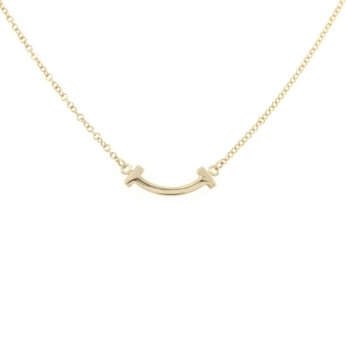 Tiffany T Smile Mini Necklace: --- Catalog ---Category: SizePendant Size: 3.5mm x 13.3mm / 0.13'' x 0.52''Neck Circumference: 41 cm - 46 cm / 16.14'' - 18.11''Category: DesignGender: WomenMaterial: Yellow gold (18K)Pendant Type: