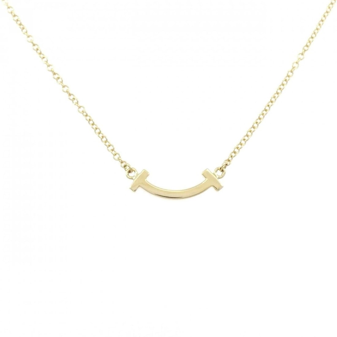 Tiffany T Smile Mini Necklace: --- Catalog ---Category: SizePendant Size: 3.6mm x 13.2mm / 0.14'' x 0.51''Neck Circumference: 41 cm - 46 cm / 16.14'' - 18.11''Category: DesignGender: WomenMaterial: Yellow gold (18K)Pendant Type: