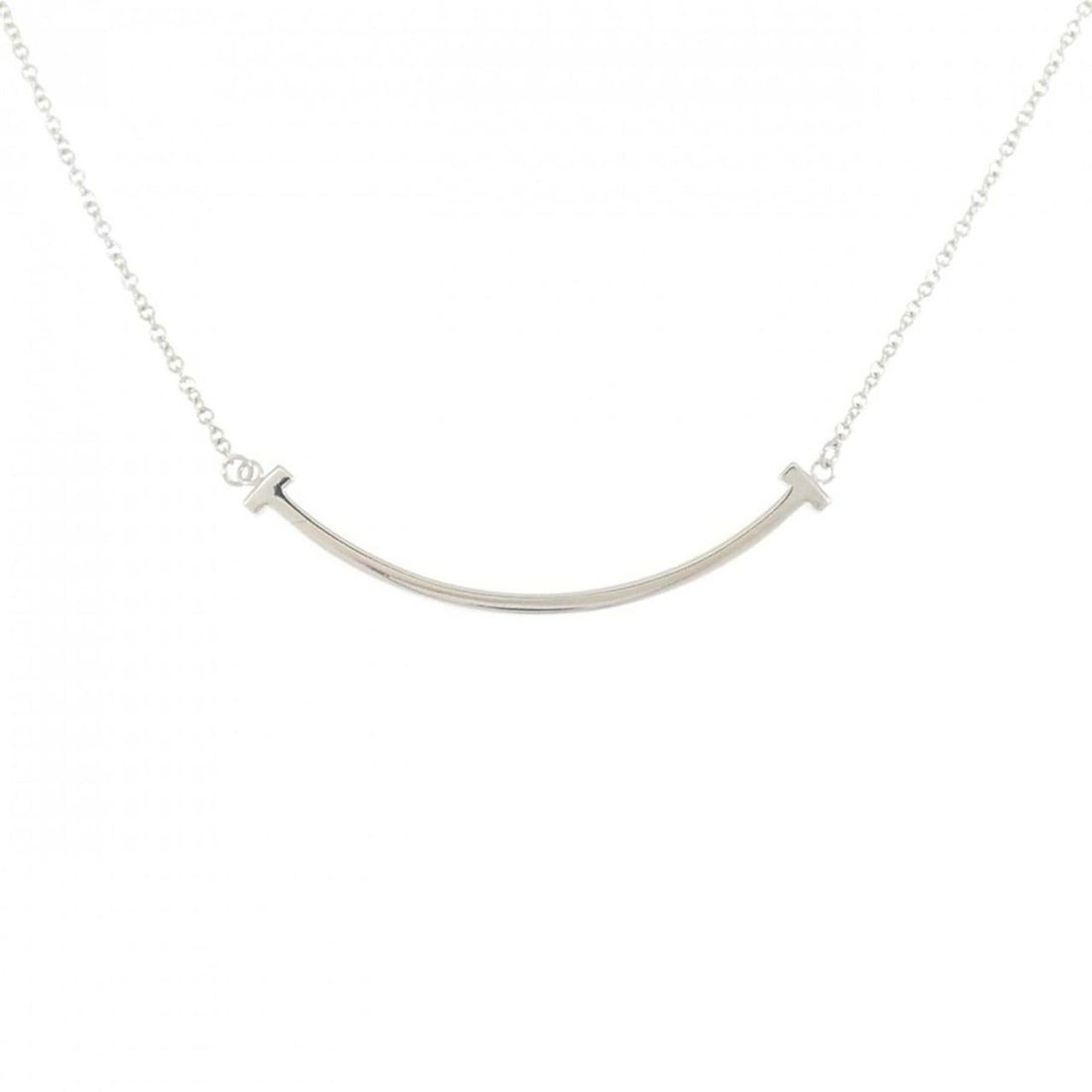 Tiffany T Smile Small Necklace: --- Catalog ---Category: SizePendant Size: 36.9mm x 3.6mm / 1.45'' x 0.14''Neck Circumference: 40 cm - 45 cm / 15.74'' - 17.71''Category: DesignGender: WomenMaterial: White gold (18K)Pendant Type:
