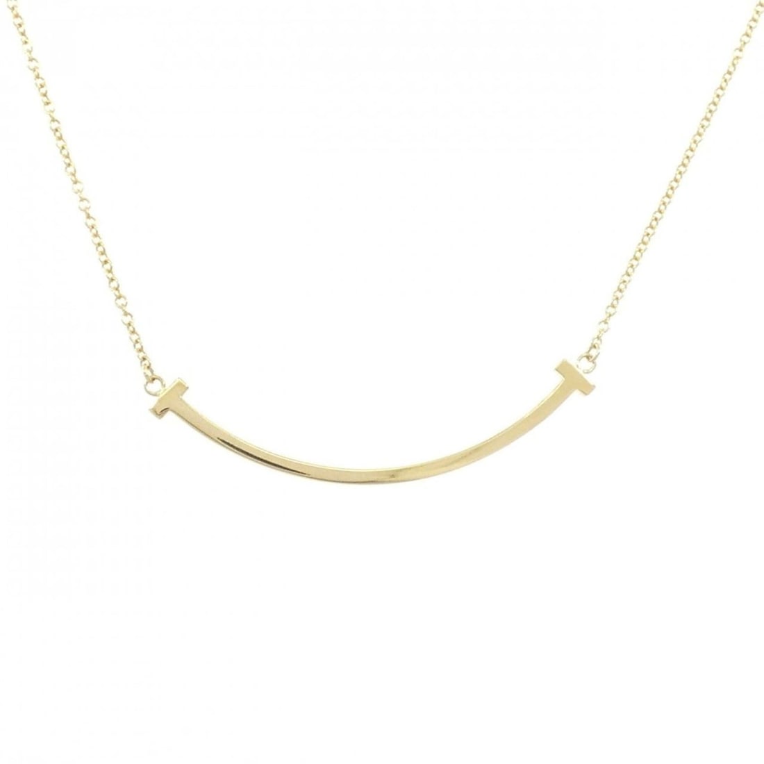 Tiffany T Smile Small Necklace: --- Catalog ---Category: SizePendant Size: 3.6mm x 37mm / 0.14'' x 1.45''Neck Circumference: 41 cm - 46 cm / 16.14'' - 18.11''Category: DesignGender: WomenMaterial: Yellow gold (18K)Pendant Type: