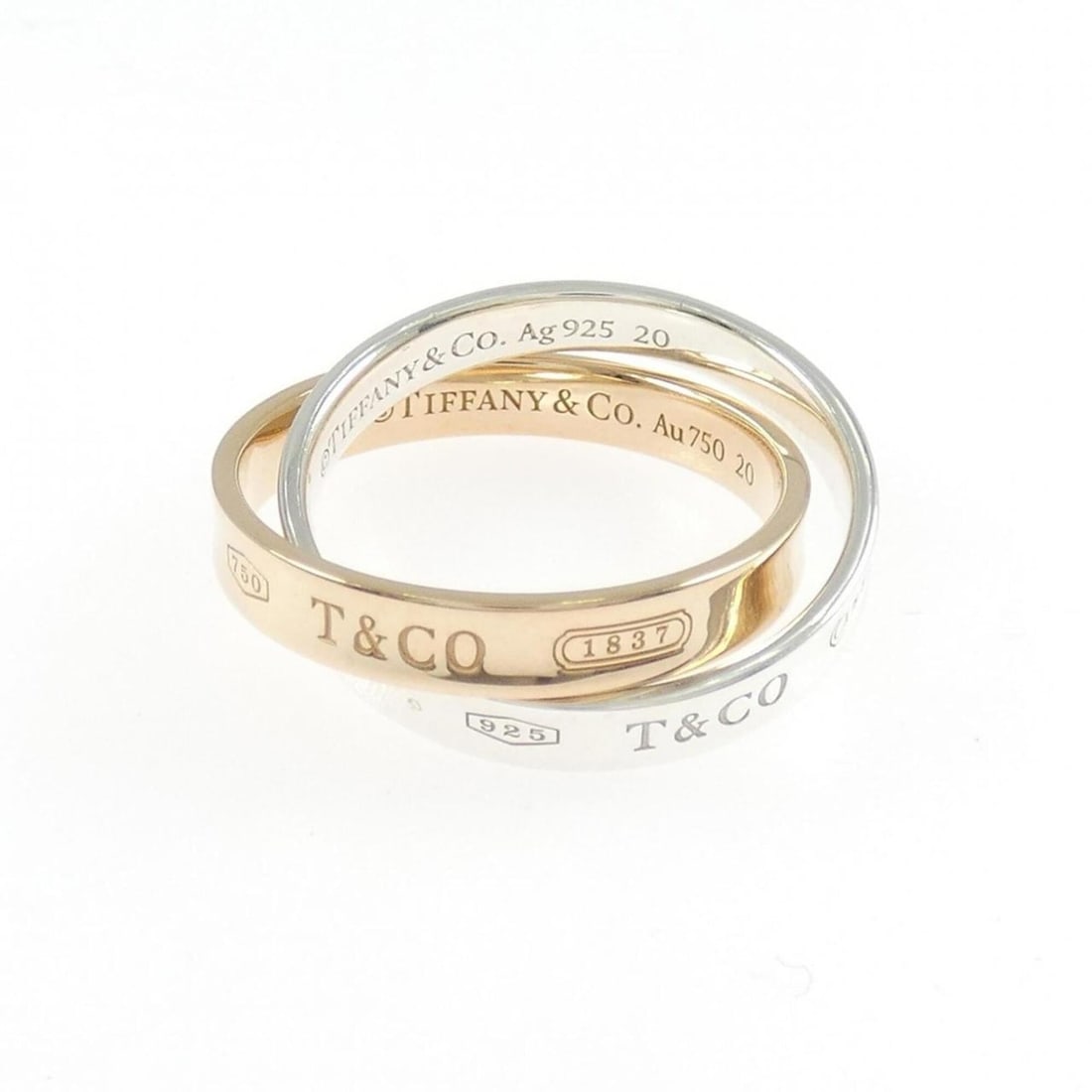 Tiffany & Co. 1837 Interlocking Circle Ring: --- Catalog ---Category: SizeJP Size: 14US Size: 7Category: DesignType: Band ringGender: WomenMaterial: Pink gold (18K), Silver 925Category: GeneralBrand: Tiffany--- Item List ---Section: