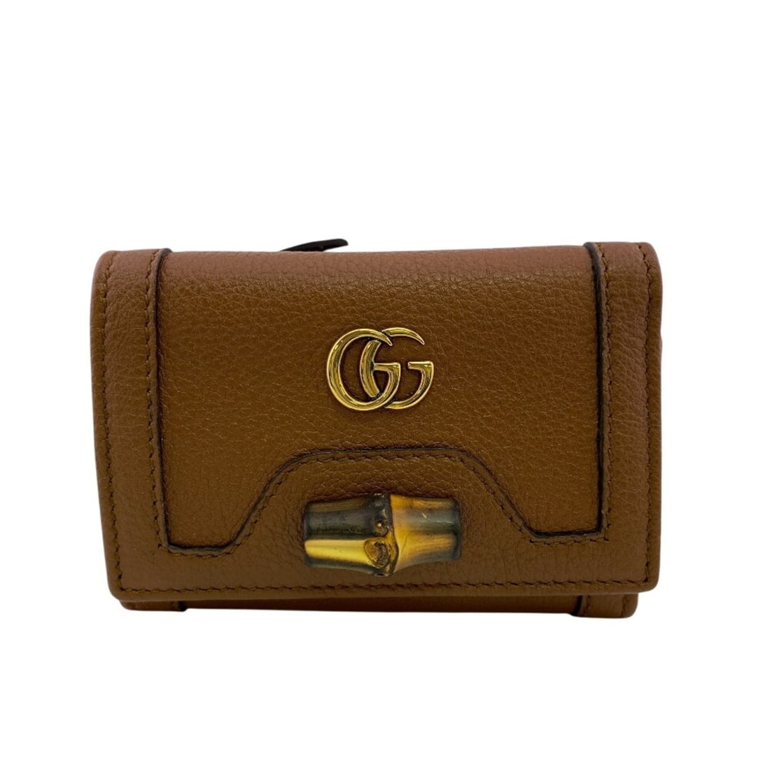 GUCCI 658633 Mini Wallet, Double G Hardware, Snap Button Closure, Bamboo, GG Marmont, Tri-fold Brown: --- Catalog ---Category: SizeSize (HxWxD): 8cm x 10.5cm / 3.14'' x 4.13''Category: DesignType: Wallet (tri-fold)Color: BrownGender: WomenMaterial: Leather Category: GeneralLine: BambooBrand: Gucci---