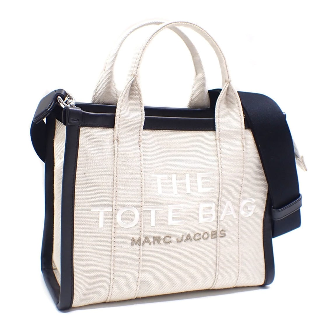 Marc Jacobs The Tote Bag Small Women's White Black Canvas Shoulder Handbag: --- Catalog ---Category: SizeSize (HxWxD): 20cm x 26cm x 12cm / 7.87'' x 10.23'' x 4.72''Category: DesignType: Tote bagColor: Black, WhiteGender: WomenMaterial: Canvas Category: GeneralBrand: Marc Jac