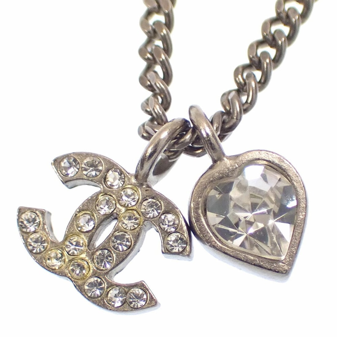 Chanel Coco Mark Necklace for Women, Rhinestone Metal, Silver Color, Heart Design, 10C: --- Catalog ---Category: SizePendant Size: 11.5mm x 10mm / 0.45'' x 0.39''Neck Circumference: 42 cm / 16.53''Category: DesignColor: SilverGender: WomenMaterial: MetalNecklace Type: NecklaceCategory: G