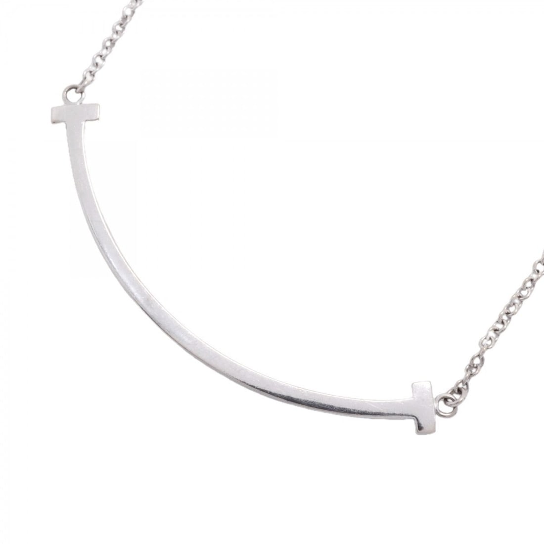 Tiffany & Co. T Smile Small Necklace, 18K White Gold, Women's: --- Catalog ---Category: SizePendant Size: 10mm x 37.1mm / 0.39'' x 1.46''Neck Circumference: 40.5 cm - 45.5 cm / 15.94'' - 17.91''Category: DesignGender: WomenMaterial: White gold (18K)Necklace Type: