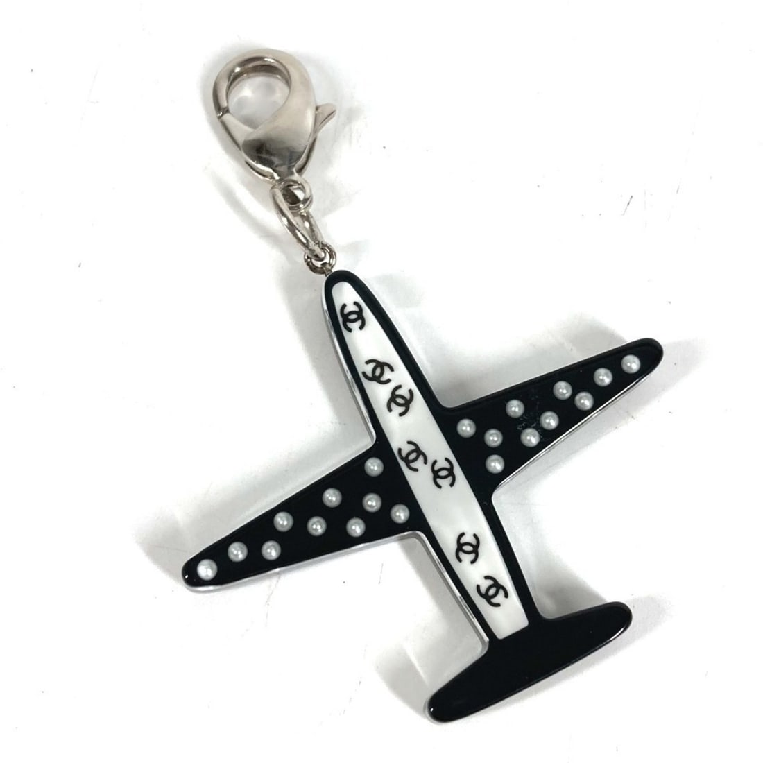 CHANEL 16S Airplane Accessory Bag Charm Keychain Plastic Women's Black: --- Catalog ---Category: DesignType: KeyringColor: Black, WhiteGender: WomenMaterial: PlasticCategory: GeneralBrand: ChanelCountry of Origin: France--- Item List ---Section: ConditionRanking: Rank A U