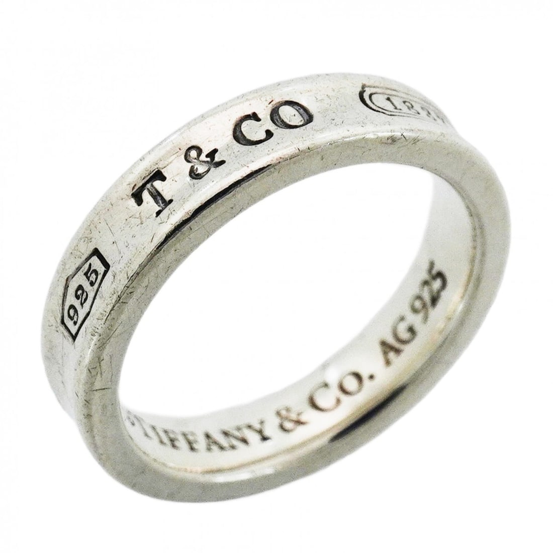 Tiffany & Co. Narrow Ring, Sterling Silver 925, Size 7.5, Women's: --- Catalog ---Category: SizeJP Size: 7.5US Size: 4Category: DesignType: Band ringGender: WomenMaterial: Silver 925Category: GeneralBrand: Tiffany--- Item List ---Section: ConditionRanking: Rank AB Us