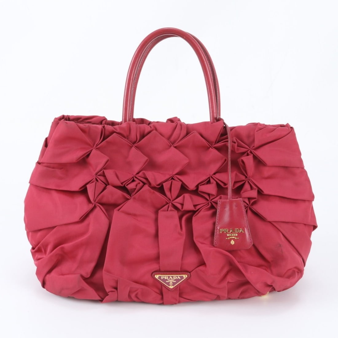 Prada Tessuto Nylon Triangle Logo Frill Leather Tote Handbag Shoulder for Women: --- Catalog ---Category: SizeSize (HxWxD): 22cm x 28cm x 14cm / 8.66'' x 11.02'' x 5.51''Category: DesignType: HandbagColor: BlackGender: WomenMaterial: Nylon , Leather Category: GeneralBrand: PradaCo