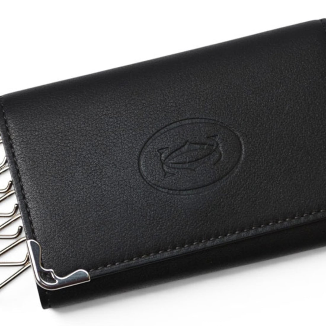 Cartier Key Case Holder, 6-ring Must de Cartier, Black, 2C CRL3001359: --- Catalog ---Category: DesignType: KeycaseColor: BlackGender: Women,MenCategory: GeneralBrand: CartierCountry of Origin: ItalyCategory: Physical PropertiesSize (HxWxD): 6.5cm x 10cm x 1.5cm / 2.55''