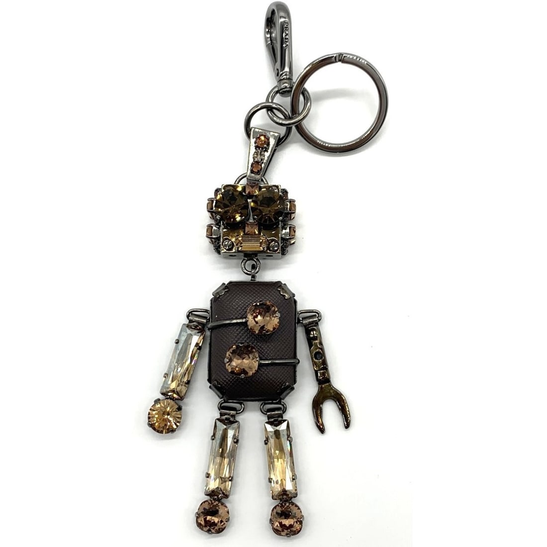 Prada Robot Keyring, Fiano Leather Keyring Charm: --- Catalog ---Category: SizeWeight: 81.6g / 2.87oz.Category: DesignType: KeyringGender: Women,MenMaterial: MetalCategory: GeneralBrand: Prada--- Item List ---Section: ConditionRanking: Rank B Used - 