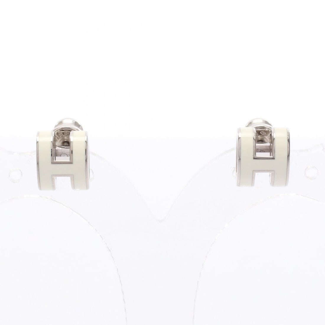 Hermes Mini Pop H earrings, stainless steel, women's jewelry, silver/ivory.: --- Catalog ---Category: DesignType: Stud earringsColor: Ivory, SilverGender: WomenMaterial: Stainless steelCategory: GeneralBrand: Hermes--- Item List ---Section: ConditionRanking: Rank A Used - A fe