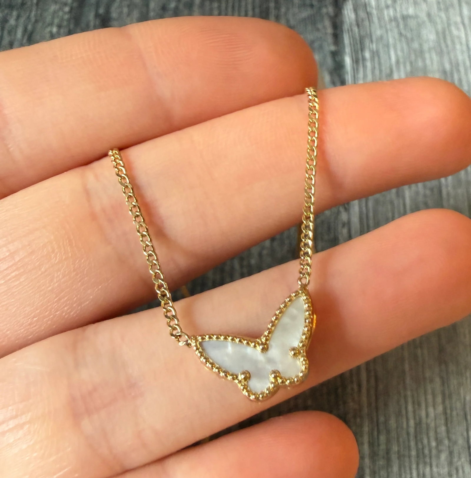 Mother Of Pearl Butterfly Necklace in 14K Gold, 16.25?? Long (S): Metal: 14K Yellow GoldWeight: 3.2 gramsLength: 16.25 inches long Markings: "14K"Condition: In good condition with some minor surface wear Follow us on Instagram @alphaomegajewelry for the latest updat