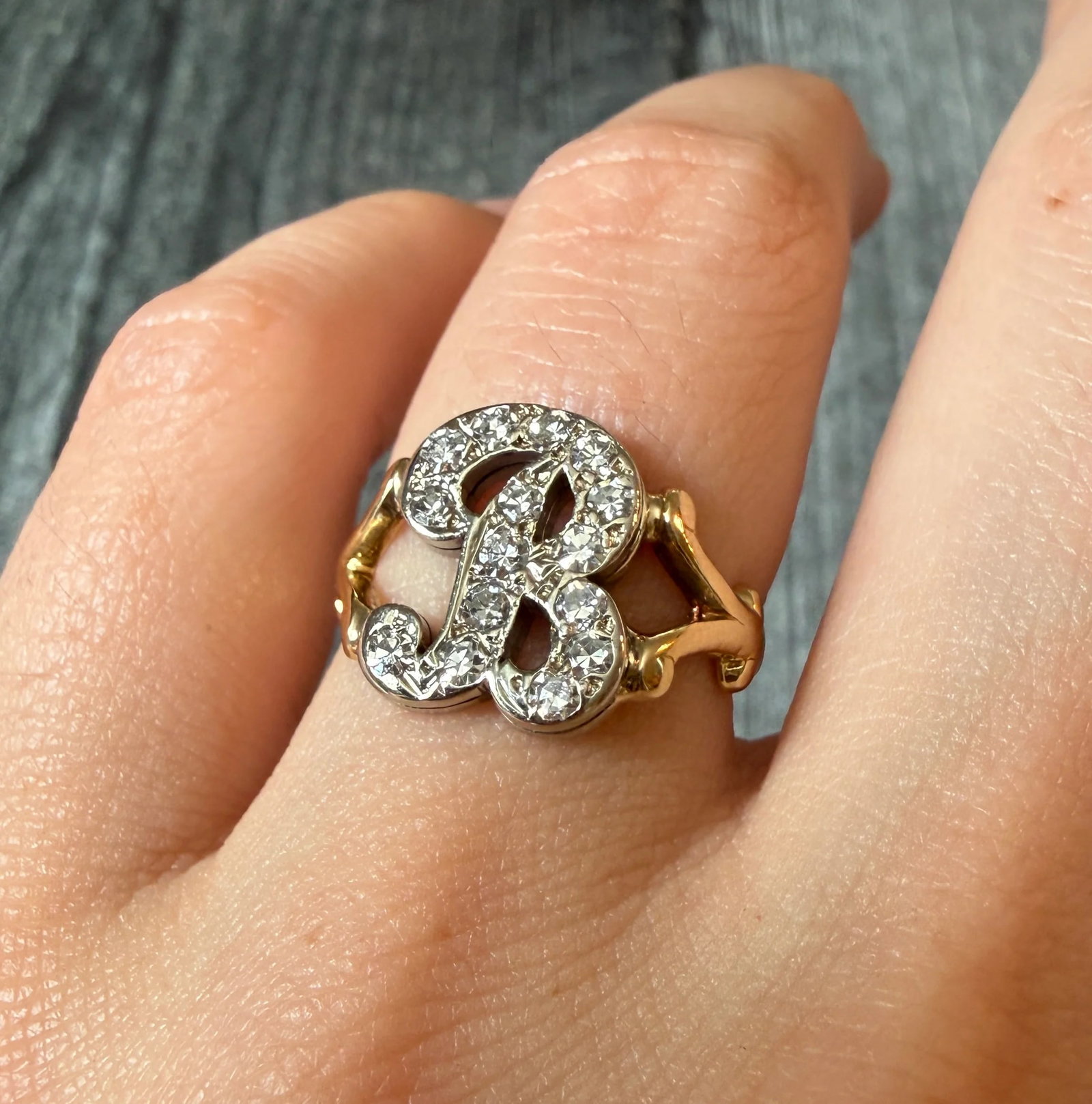 Vintage Diamond and Two Tone Initial B Ring in 14K Gold (S): Metal: 14K Yellow and White Gold Weight: 5.9 gramsDiamonds: Approximately 0.09 caratsRing Size: 6 (resizable)Condition: In good condition with some minor surface wear Follow us on Instagram @alphaomeg