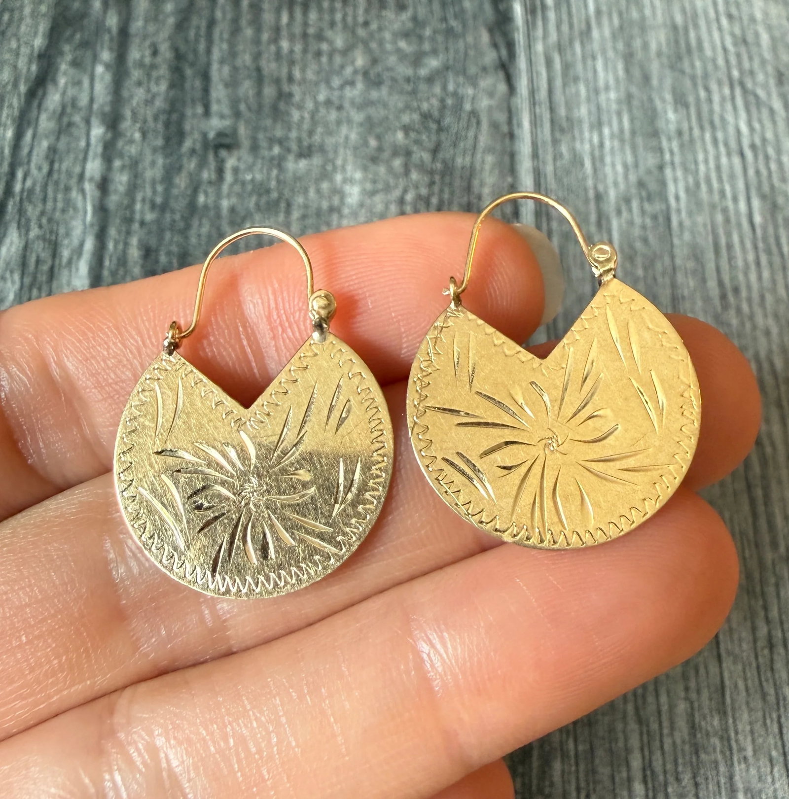 Vintage Engraved Crescent Hoop Earrings in 14K Gold: Metal: 14K Yellow Gold (acid tested)Weight: 2.8 gramsMeasurements: 1.2“ long by 0.9” wideCondition: In good condition with some minor surface wear Follow us on Instagram @alphaomegajewelry for
