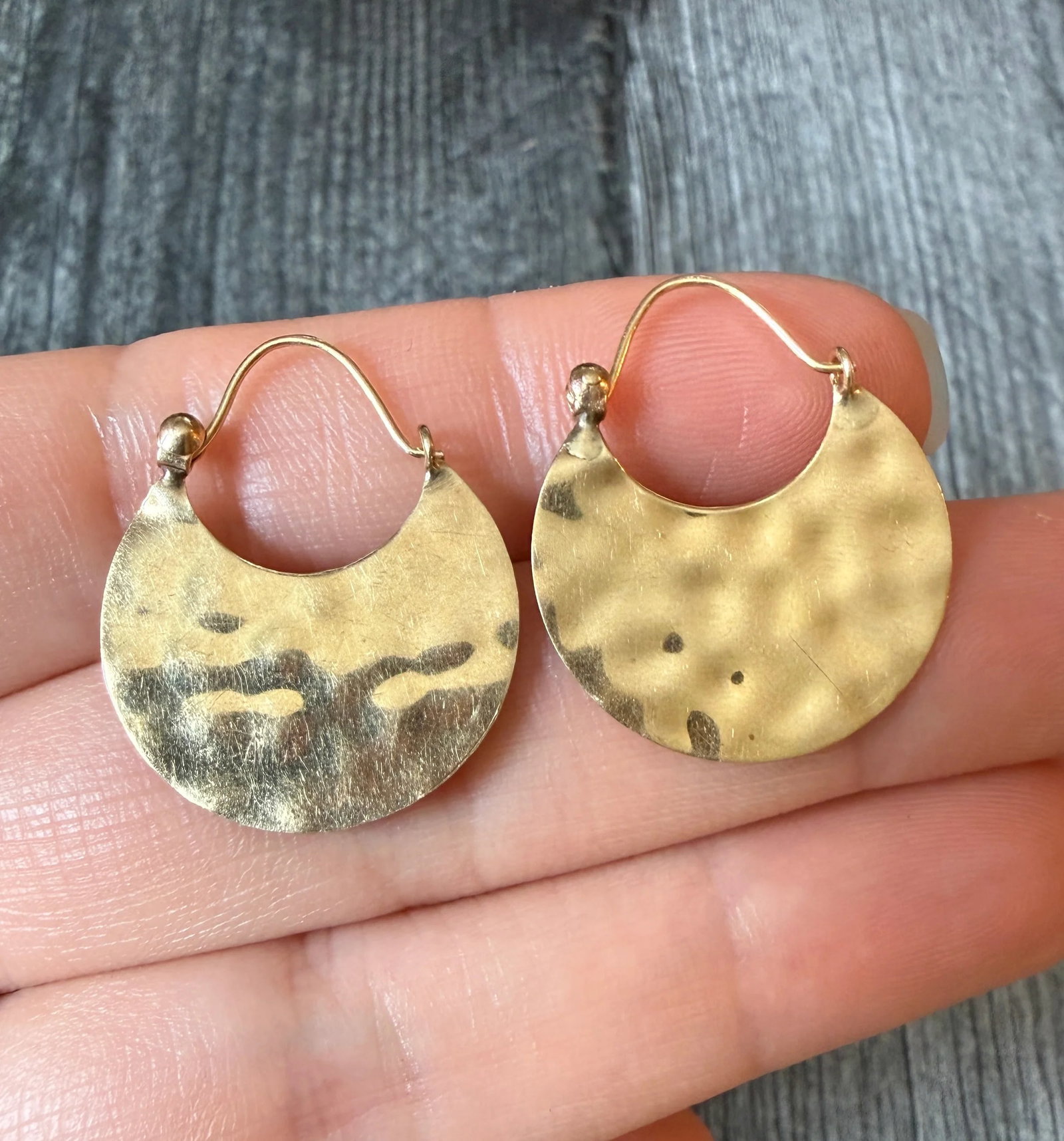 Vintage Hand Hammered Crescent Hoop Earrings in 14K Gold: Metal: 14K Yellow Gold Weight: 2.2 gramsMeasurements: 1“ long by 0.9” wideMarkings: "14K"Condition: In good vintage condition with some minor surface wear Follow us on Instagram @alphaomegajew