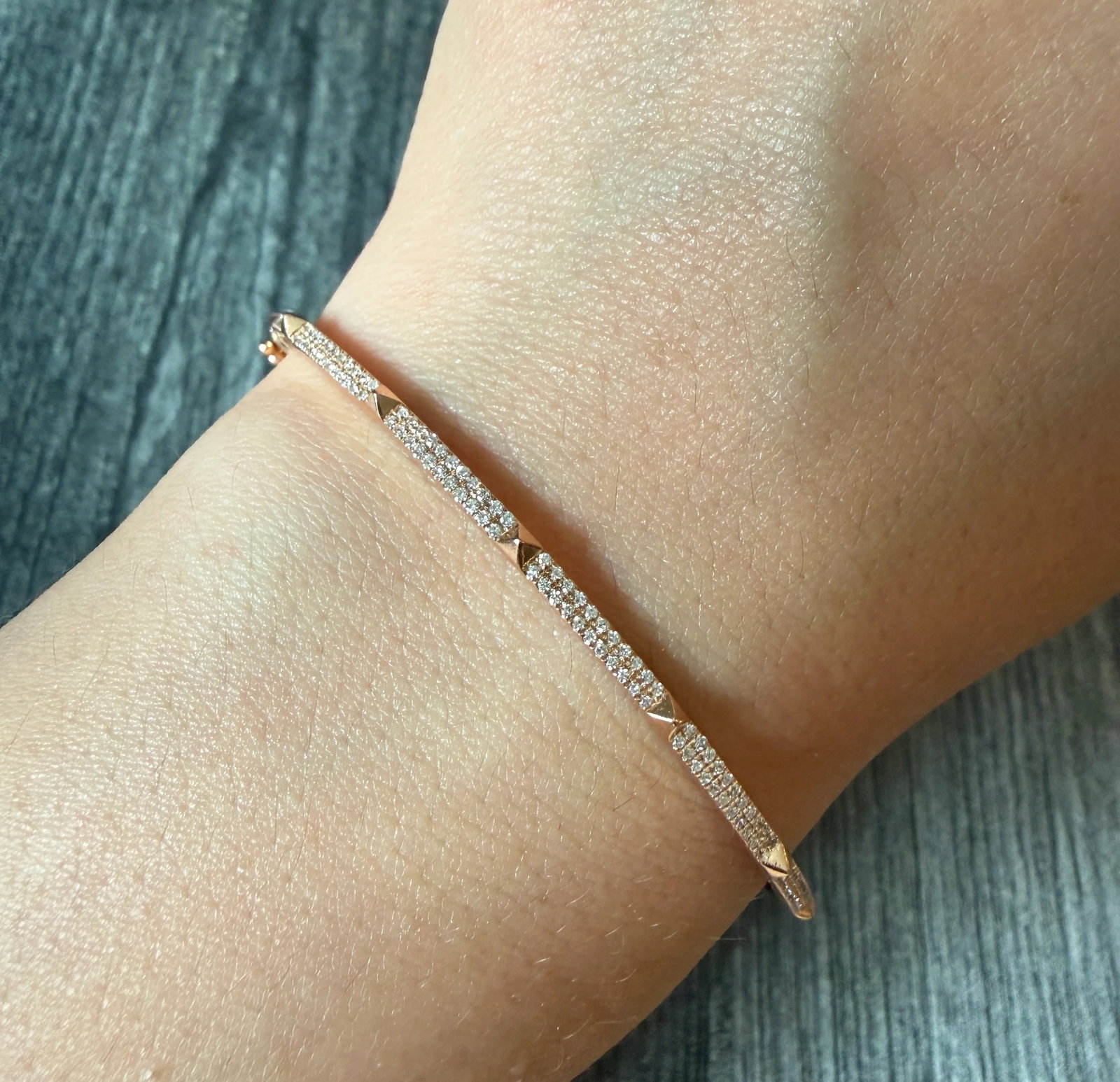 Diamond Pave Pyramid Bangle in 14K Rose Gold: Metal: 14K Rose Gold Weight: 6.5 gramsInner Circumference: 6.5 inchesWidth: 2.1 mm wideInner diameter: 1.75 inches long by 2.15 inches wide Markings: “14K 585”Condition: In good condition with