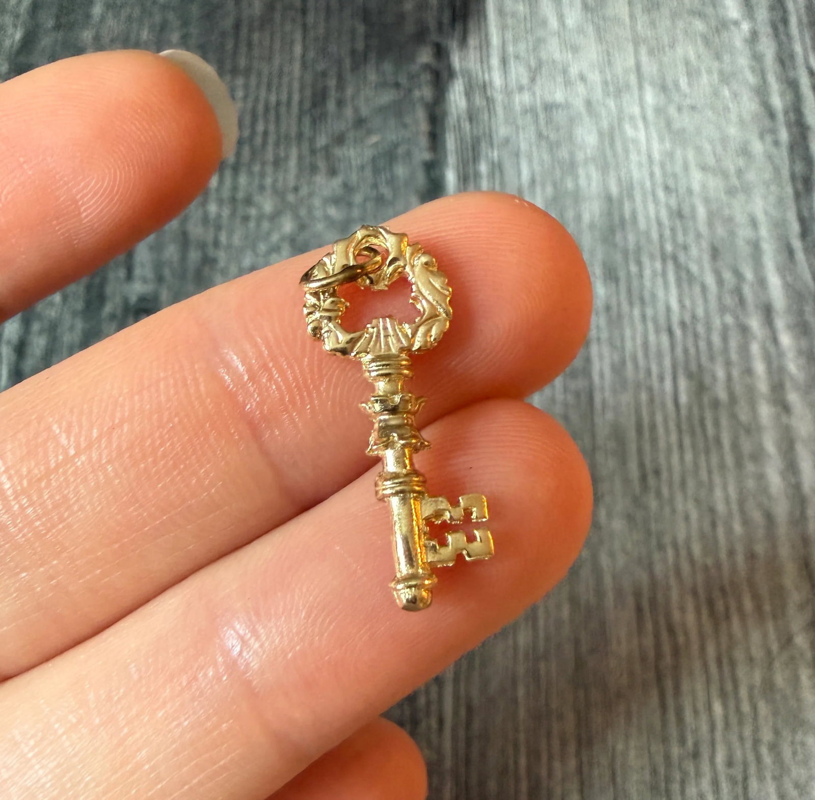 Ornate 10K Gold Skeleton Key Charm: Metal: 10K Yellow Gold (acid tested)Weight: 1.3 gramsMeasurements: 0.95 inches long by 0.35 inches wideMarkings: NoneCondition: In good condition with some minor surface wear Follow us on Instagram @a