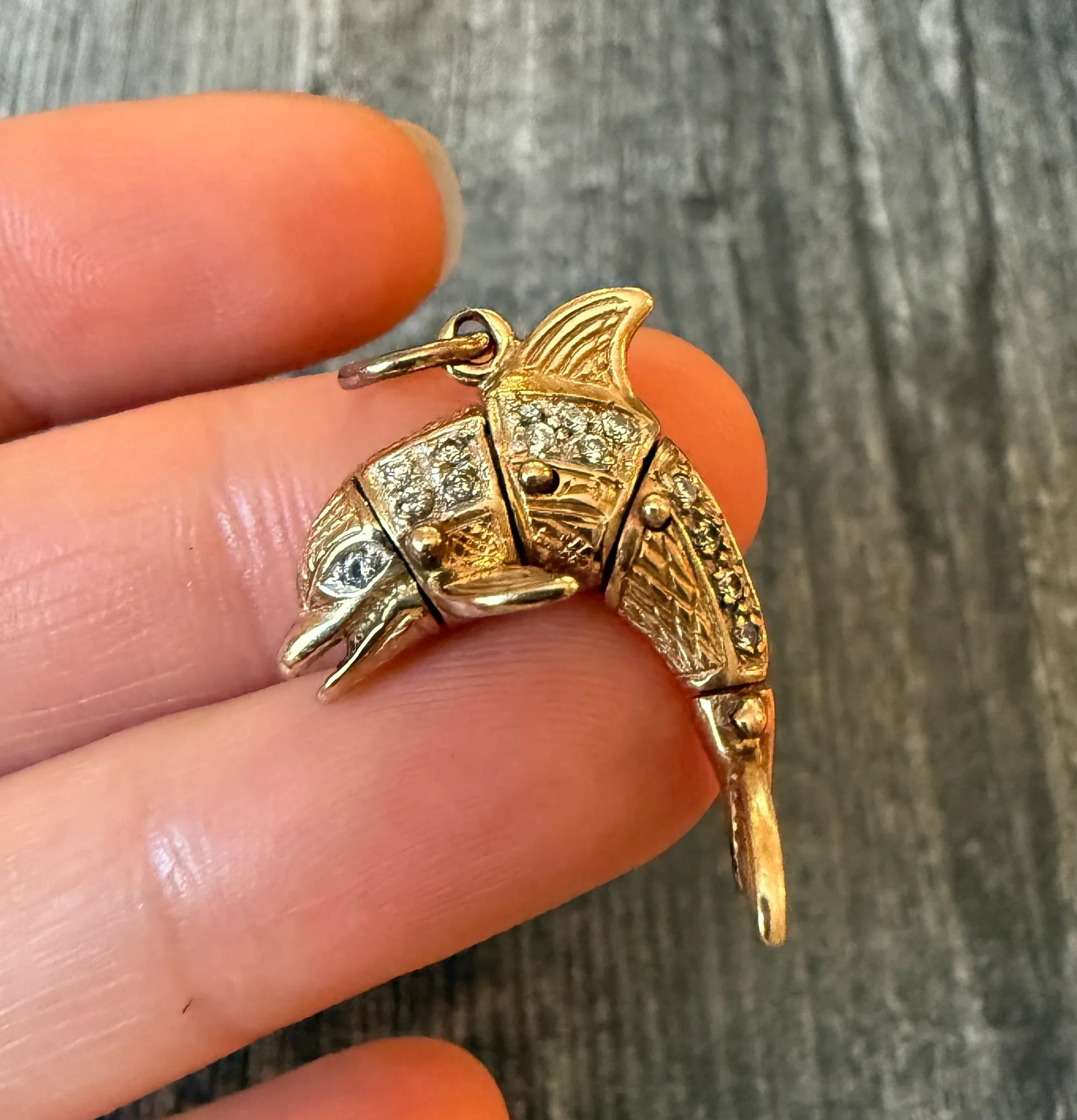 Movable 10K Gold Dolphin Charm (S): Metal: 10K Yellow and White GoldWeight: 5.4 gramsMeasurements: 1 inch long by 0.9 inches wideMarkings: Likely English hallmarksCondition: In good condition with some minor surface wear Follow us on