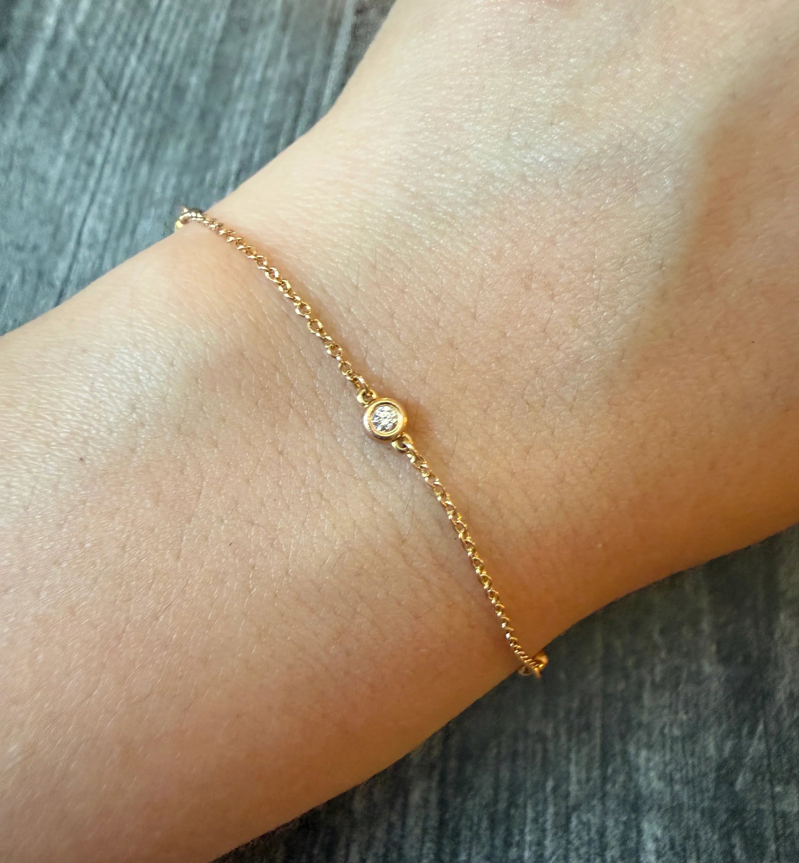 Tiffany & Co Elsa Peretti Diamond by the Yard Bracelet (S): Metal: 18K Rose Gold Weight: 1.7 gramsDiamonds: Approximately 0.15 caratsMeasurements: 7.2 inches long by 3.7 mm wideMarkings: "SPAIN PERETTI AU750 Tiffany & Co"Condition: In very good condition with