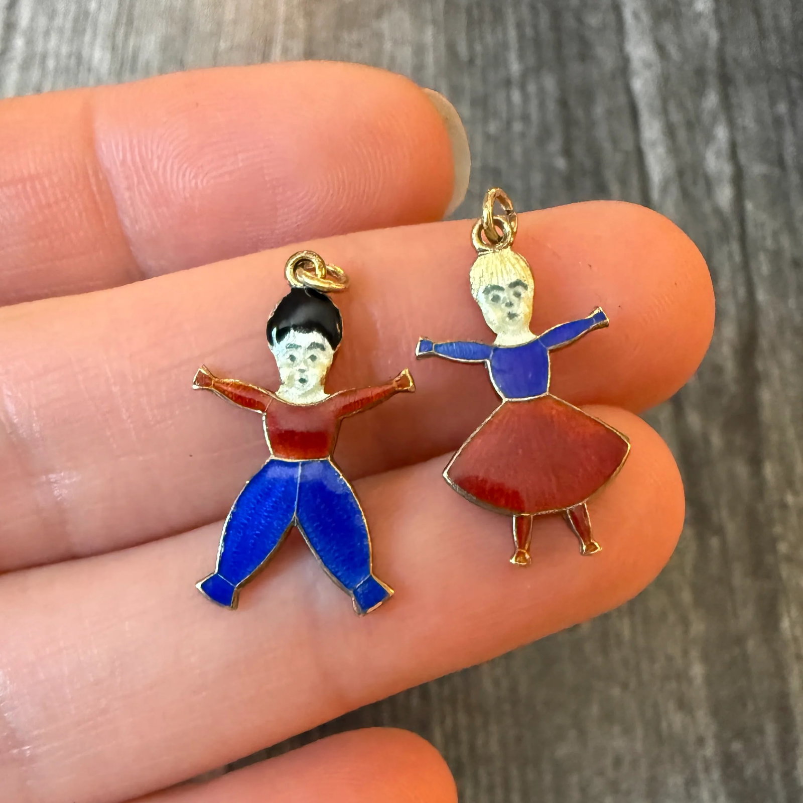 Art Deco Enameled Boy and Girl Charms in 14K Gold (S): Metal: 14K Yellow Gold Weight: 3.1 gramsMeasurements: 0.8 inches long by 0.45 inches wideCondition: In good condition with some enamel loss and some surface wear consistent with ageFollow us on
