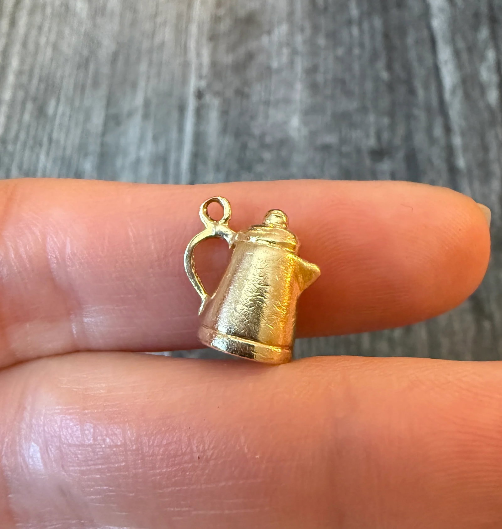 Vintage Teapot or Coffee Pot Charm in 14K Gold: Metal: 14K Yellow GoldWeight: 3.4 gramsMeasurements: 0.5 inches long by 0.5 inches wideMarkings: "14K"Condition: In very good condition with some minor surface wear. A bale can be added if requested