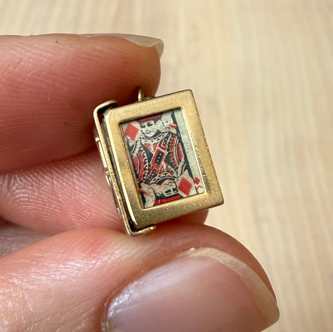 Vintage Miniature Box of Playing Cards Charm in 14K Gold: Metal: 14K Yellow GoldWeight: 3 gramsMeasurements: 0.5" long by 0.4" wideMarkings: "14K"Condition: In good vintage condition with some enamel loss and minor surface wear consistent with age.