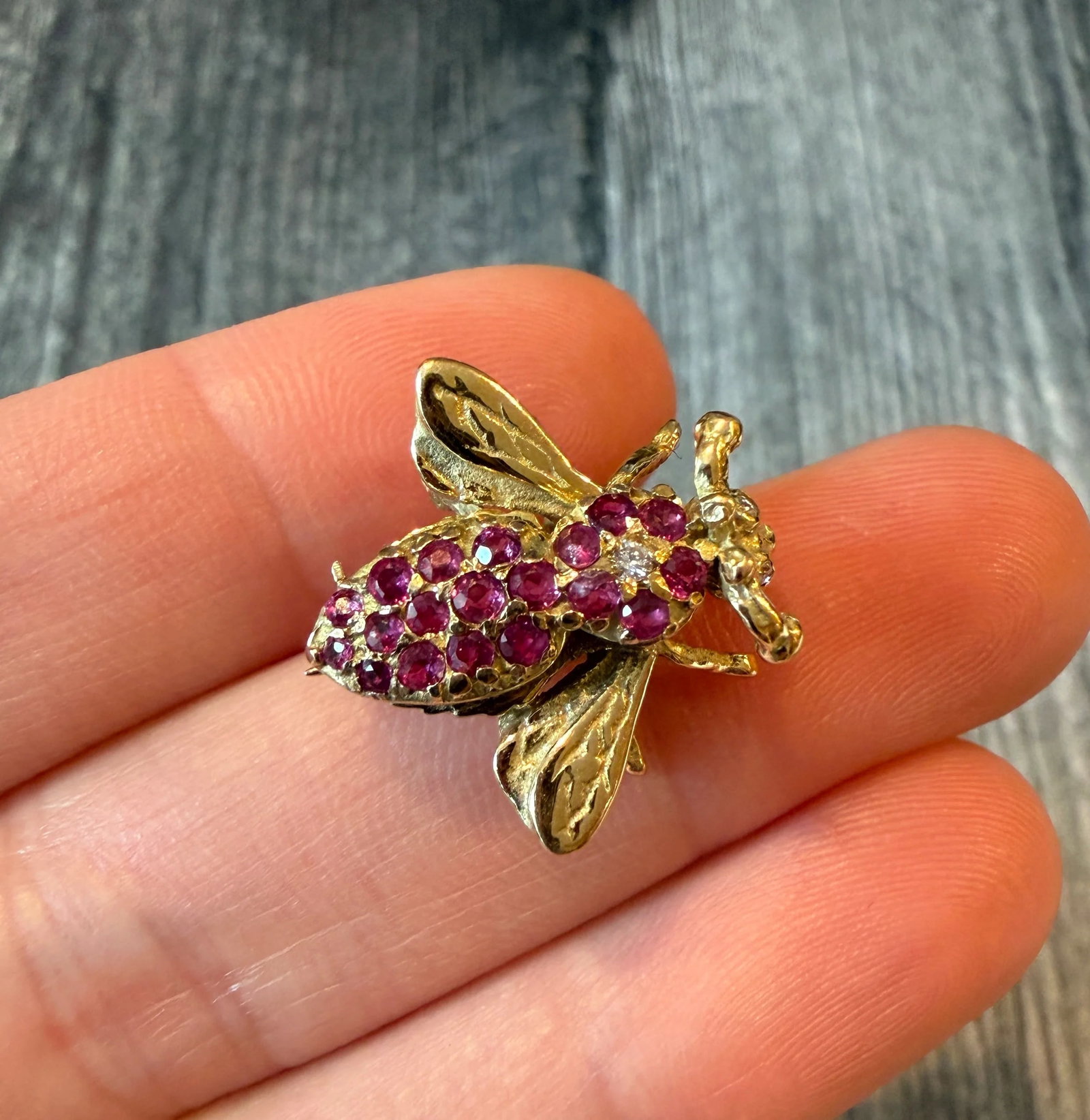 Ruby and Diamond Bee Pin in 14K Gold: Metal: 14K Yellow Gold Weight: 4.2 gramsRubies: Approximately 0.38 caratsMeasurements: 0.8 inches long by 0.8 inches wideCondition: In very good vintage condition with some minor surface wearFollow us