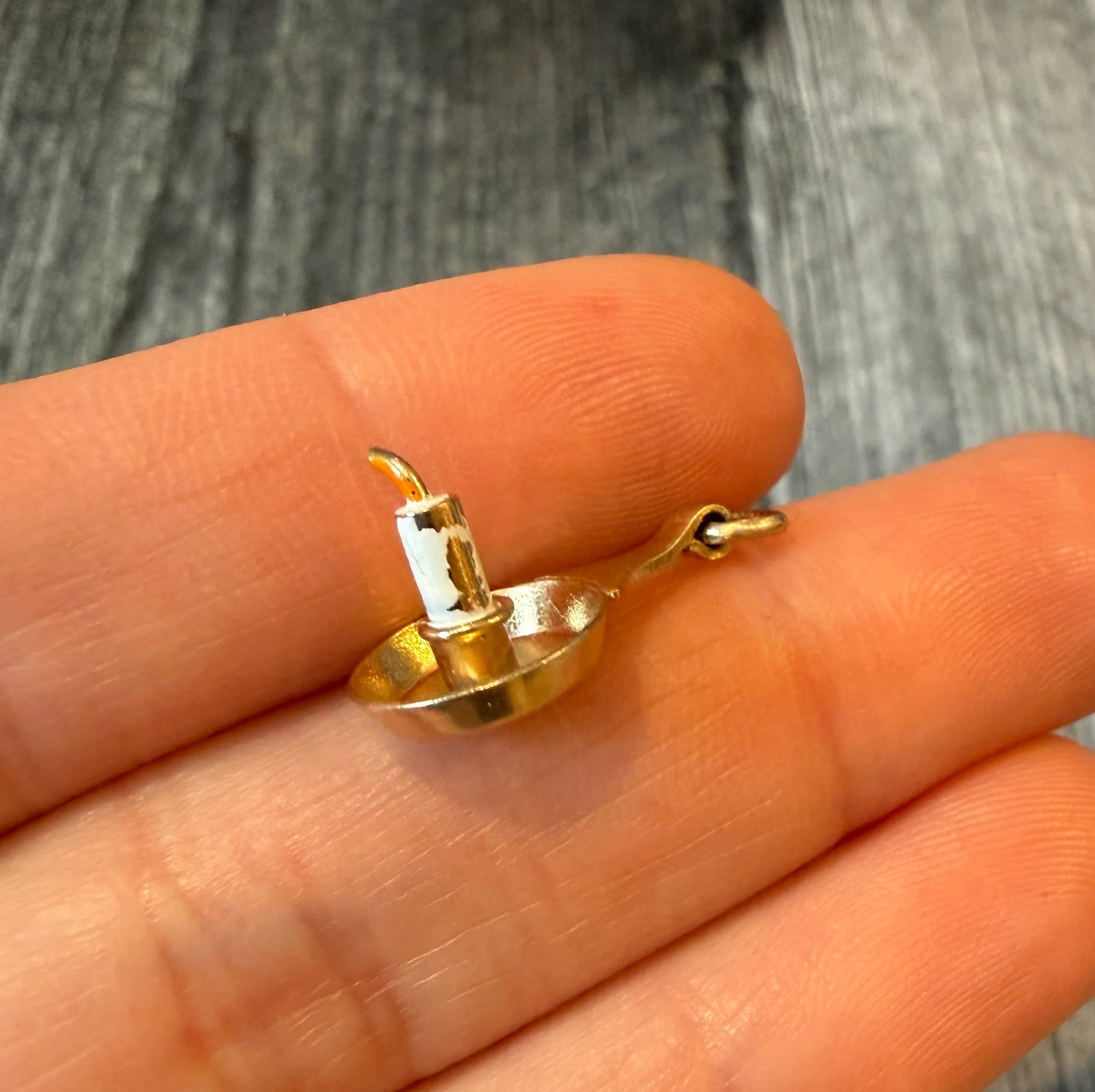 Vintage Enamel Candle Stick Charm in 14K Gold: Metal: 14K Yellow Gold Weight: 1.5 gramsMeasurements: 0.75 inches long by 0.45 inches wideMarkings: "14K"Condition: Enamel loss throughoutFollow us on Instagram @alphaomegajewelry for the latest updat