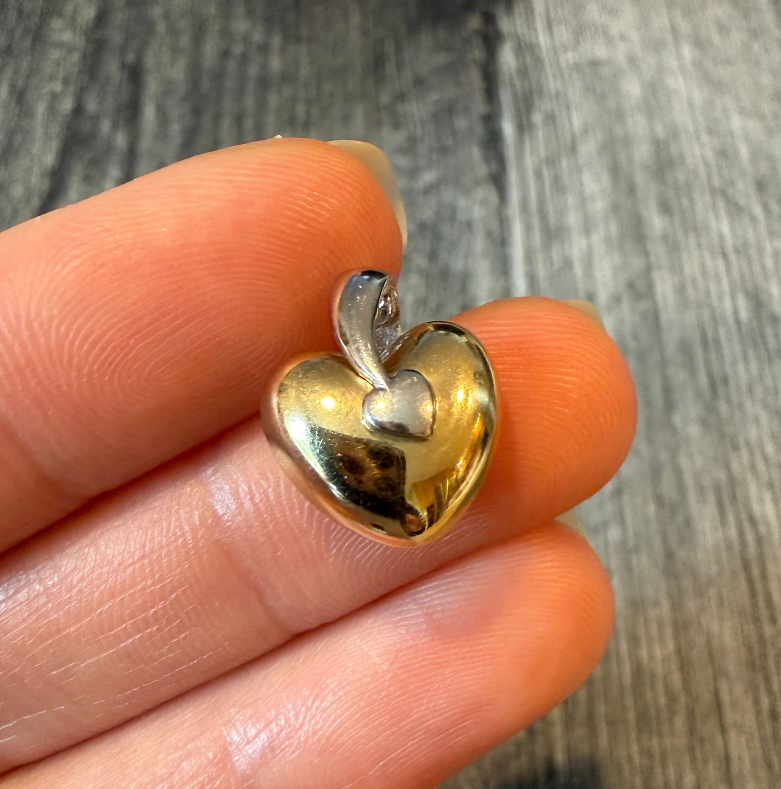 Two Tone 14K Gold Heart Charm (S): Metal: 14K White and Yellow Gold Weight: 1.7 grams Measurement: 0.7 inches long (Including bale) by 0.55 inches wideMarkings: "14K"Condition: In good condition with some minor surface wearFollow us on