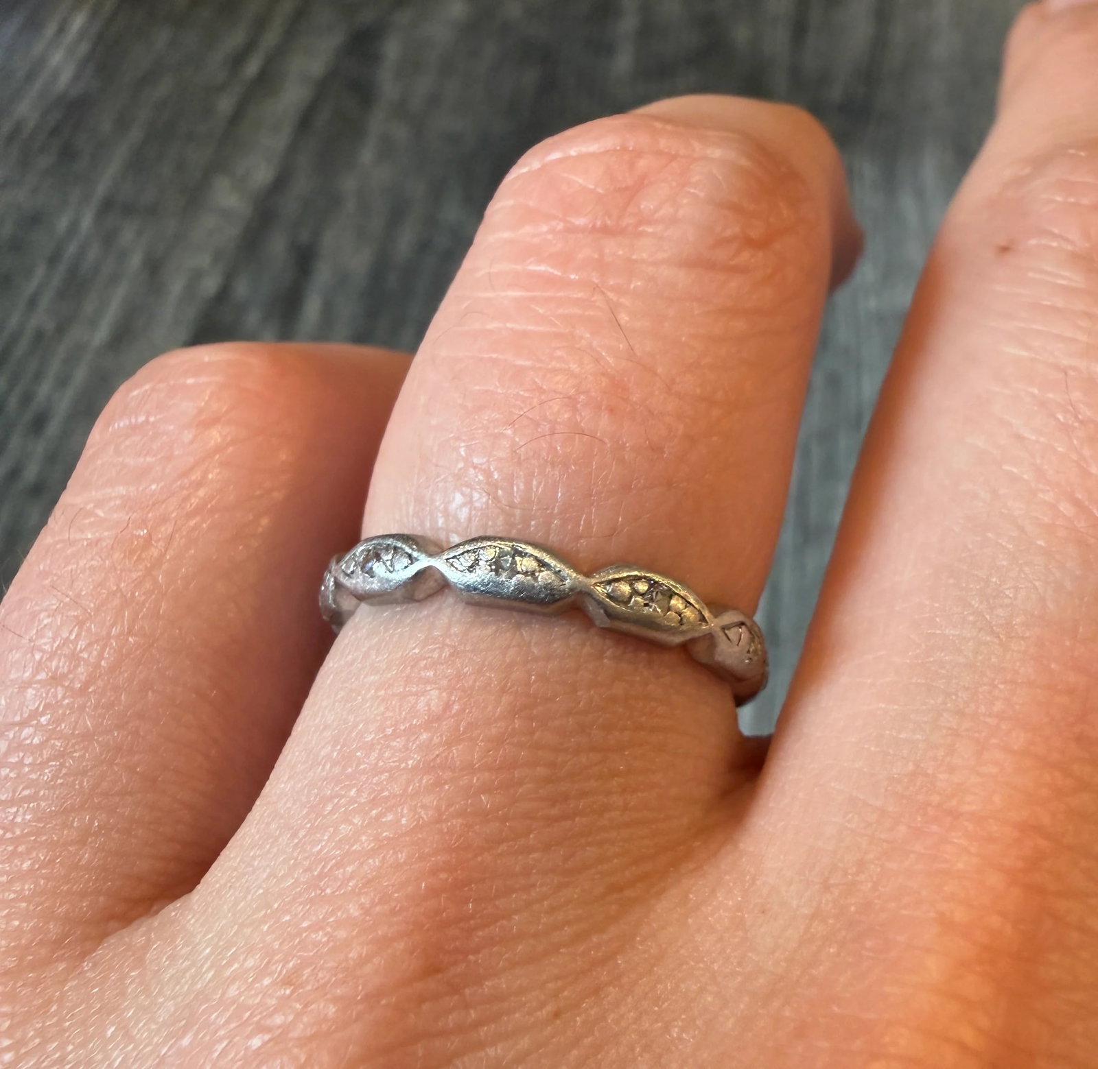 Vintage Scalloped Platinum and Diamond Eternity Band, Size 6.75: Metal: Platinum (acid tested)Weight: 3.5 gramsRing Size: 6.75 (not resizable)Diamonds: Approximately 0.06 caratsWidth: 2.7 mm wideCondition: In good vintage condition with some minor surface wear cons
