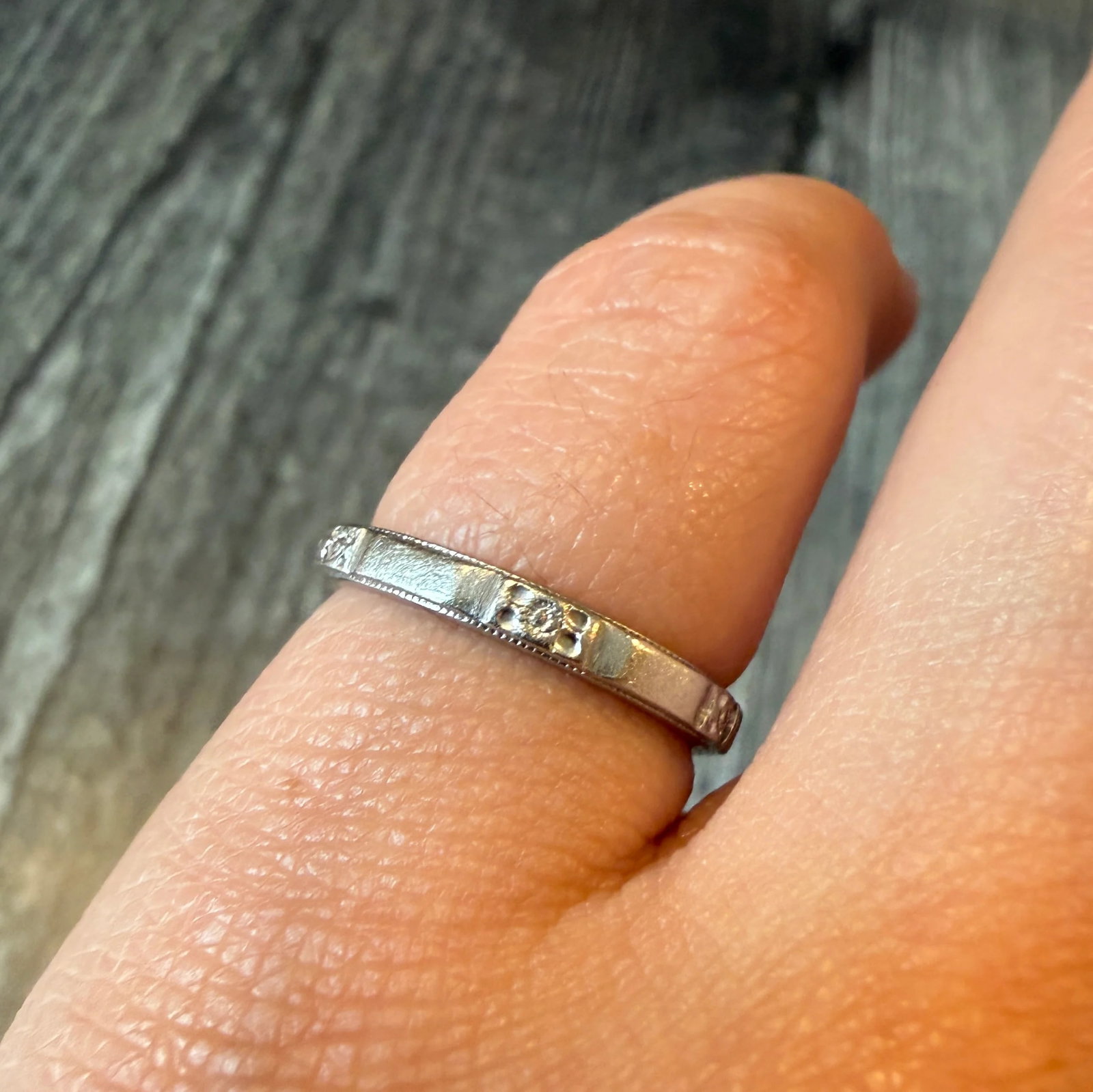 Vintage 1960s Orange Blossom Flower Band in Platinum, Size 4.75: Metal: PlatinumWeight: 4 gramsRing Size: 4.75 (not sizable)Width: 2.4 mm wideMarkings: ".900 PLAT .100 IRID" and inscribed "JMR - MAC 7-2-60"Condition: In good vintage condition with some minor surfac